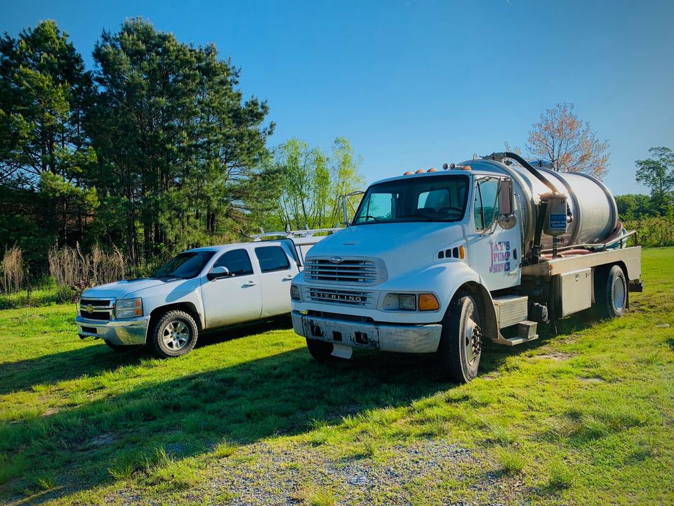 Septic pumping truck and service pickup used by Jay's Pump Service in Central Arkansas